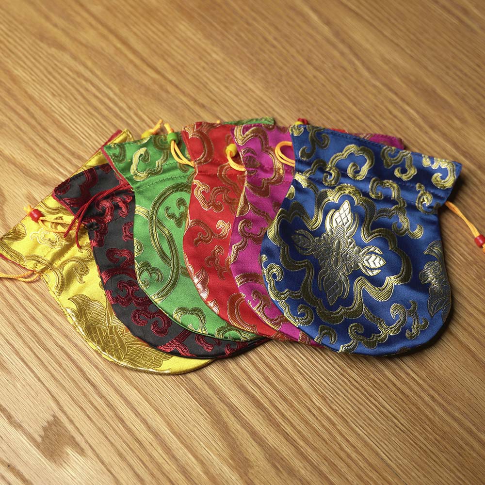 TINGSHA TIBETANA MANTRA SÍMBOLO DE LA FORTUNA PEQUEÑA (7 CM)