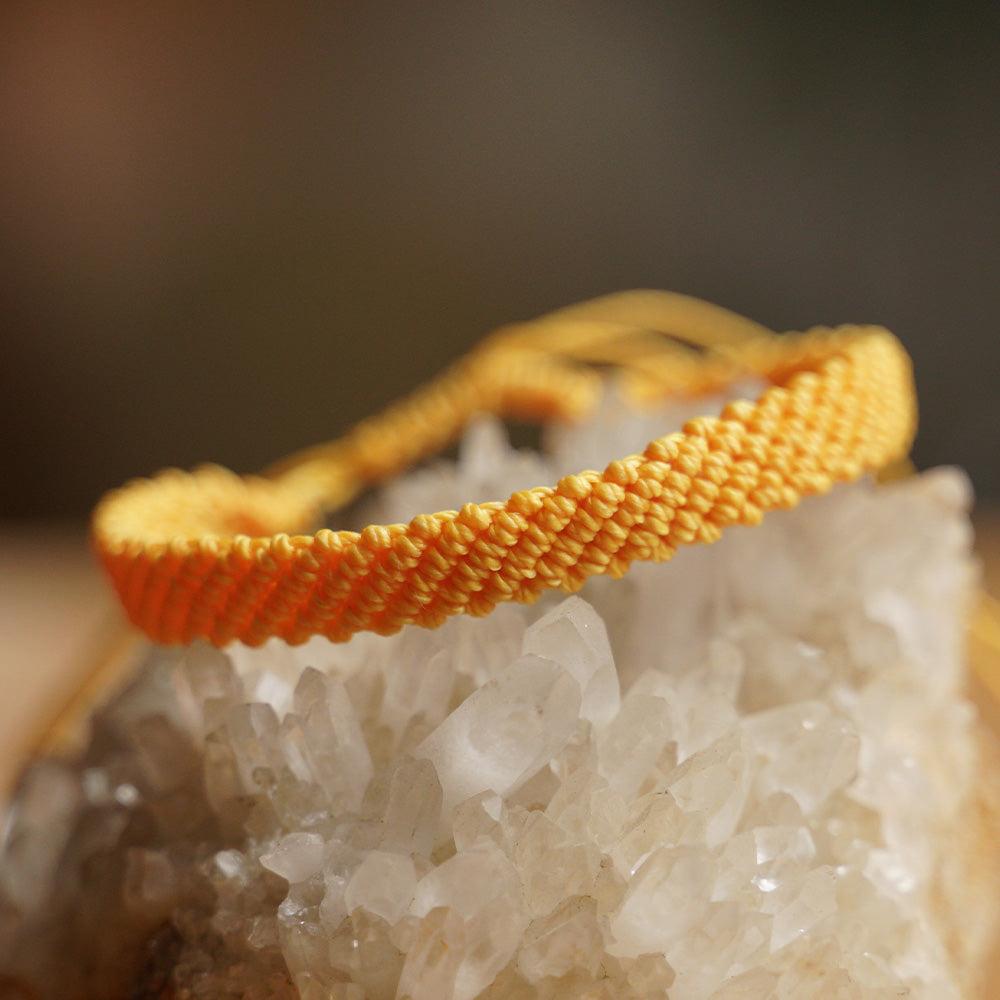 PULSERA AJUSTABLE TRENZADA HILO ENCERADO “TIERRA ANCESTRAL”