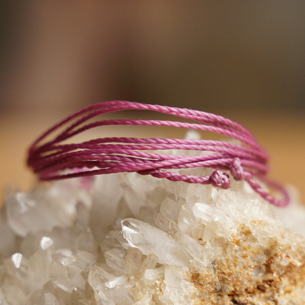 PULSERA AJUSTABLE HILO ENCERADO “COSMICA ORIGINAL MORADO”