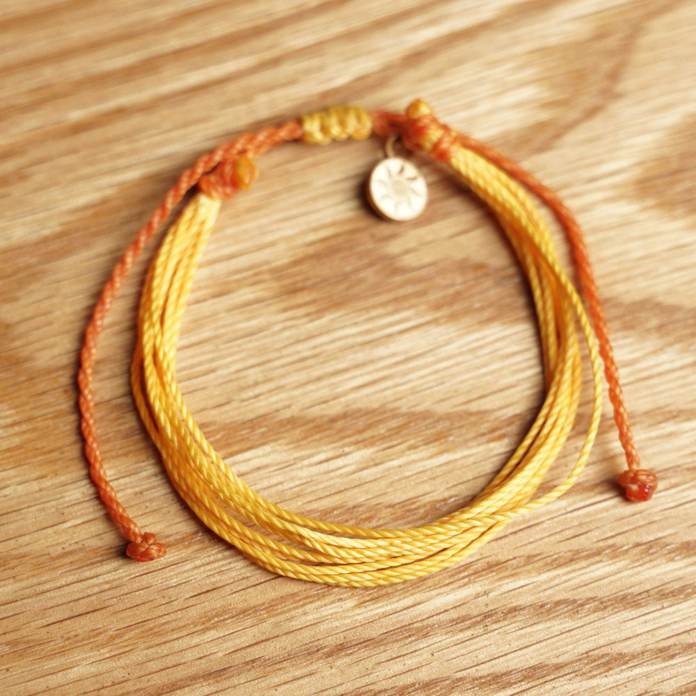 PULSERA AJUSTABLE HILO ENCERADO “GALAXIA GIRASOL”