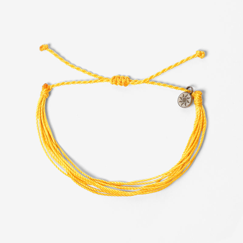 PULSERA AJUSTABLE HILO ENCERADO “COSMICA ORIGINAL AMARILLO”