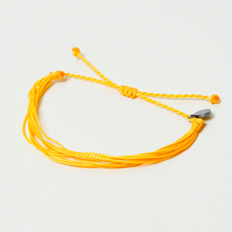 PULSERA AJUSTABLE HILO ENCERADO “COSMICA ORIGINAL AMARILLO”