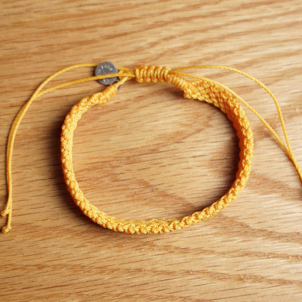 PULSERA AJUSTABLE TRENZADA HILO ENCERADO “TIERRA ANCESTRAL”