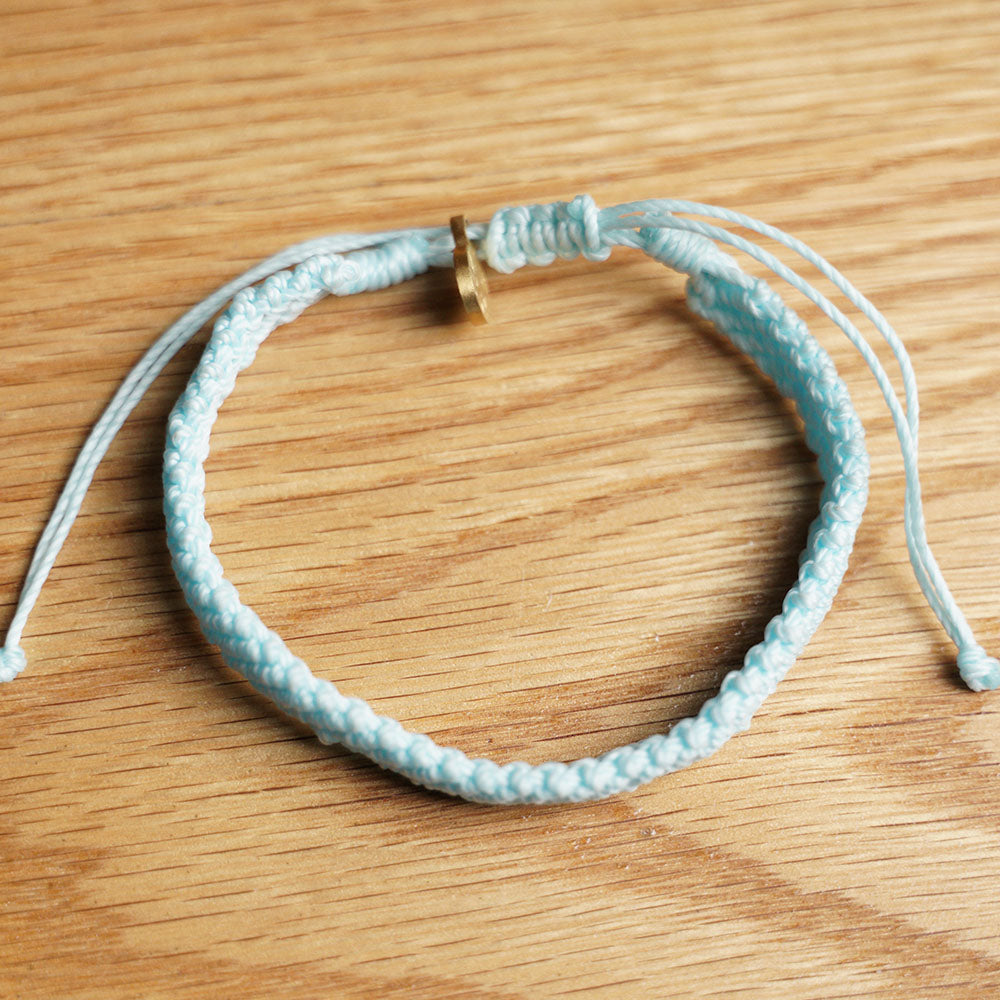 PULSERA AJUSTABLE TRENZADA HILO ENCERADO “OCÉANO ANCENSATRAL”