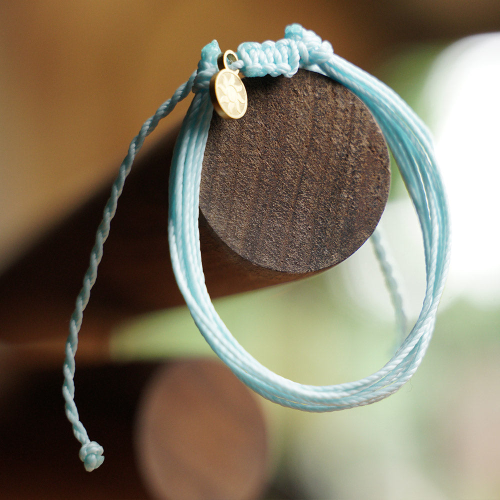 PULSERA AJUSTABLE HILO ENCERADO “COSMICA ORIGINAL CELESTE”